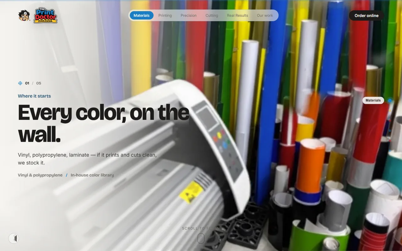 The print.doctor home page: a full-bleed photo of vinyl rolls behind the headline Every color, on the wall.
